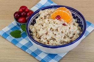 Oatmeal on wood photo