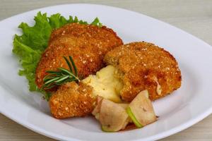 Fried cheese on wood photo