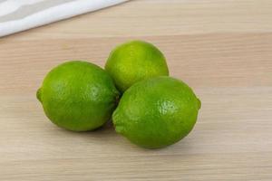 Lime on wooden background photo