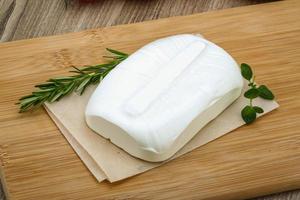 Feta cheese on wood photo