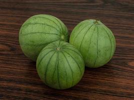 Asian eggplant on wood photo