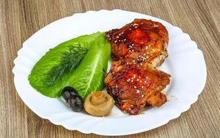 Teriyaki chicken on wood photo