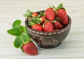 Fresh strawberry on wood photo