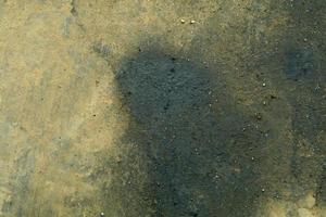 Automobile engine oil dripping on cement floor is a common stain and slippery of old cars that lack maintenance by skilled technicians. photo