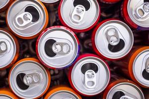 Empty aluminium drink cans recycling background concept, top view closeup photo