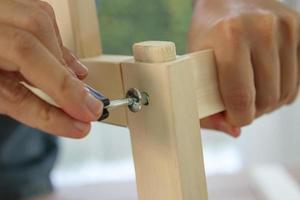 Assembly wooden furniture at home using screw allen photo