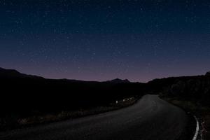 Mountain forest road night landscape photo