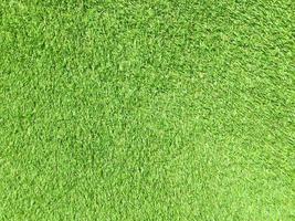 Artificial green lawn backyard for background. Texture for design photo