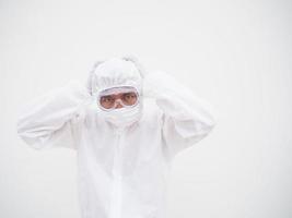 Asian male doctor or scientist in PPE suite uniform In a manner that puts his hand on his head with feeling strees and headache. coronavirus or COVID-19 concept isolated white background photo