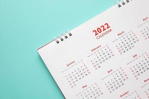 2022 calendar page on blue background business planning appointment meeting concept photo