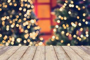 Christmas holiday background with empty wooden table photo