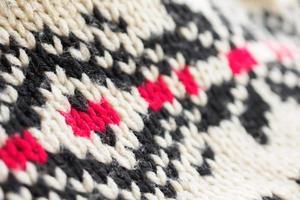 close up of knitted woolen fabric texture background photo