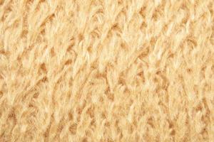 fondo de textura de lana de tela de piel esponjosa amarilla foto