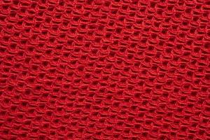 Red knitted cloth wool texture surface background photo