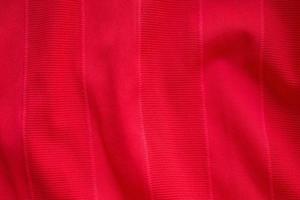 textura de jersey de tela de ropa deportiva roja foto