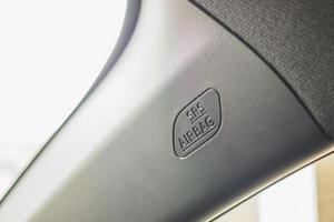 Safety side curtain airbag sign in new modern car photo