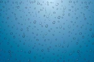 Realistic Water Drops on Blue Background. vector