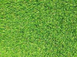 Artificial green lawn backyard for background. Texture for design photo
