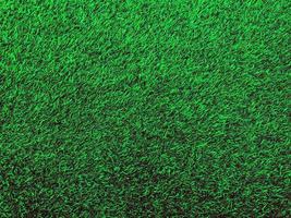 Closeup view of green grass soccer field background. Wallpaper for work and design. photo