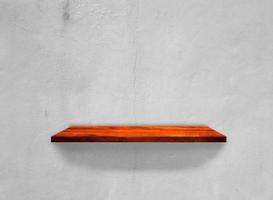 Wood shelves on concrete wall texture background with clipping path. Top view photo