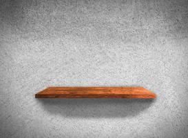 Top view of wood shelves on concrete wall texture background with clipping path for design photo