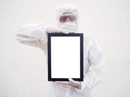 Asian doctor or scientist in PPE suite uniform. holding white screen square black frames for your design. coronavirus or COVID-19 concept isolated white background photo