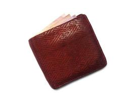 Top view of deer genuine leather wallet with red color and pattern isolated on white background. clipping path for design and work photo