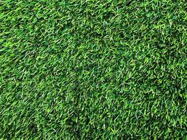 Modern green lawn texture background. Wallpaper for work and design. photo