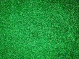 Artificial green lawn backyard for background. Texture for design photo