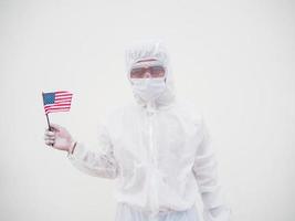 Portrait of doctor or scientist in PPE suite uniform holding national flag of United states of America. COVID-19 concept isolated white background photo