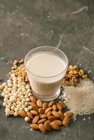 Glasses of milk with nuts Macadamia, almond, soy, rice, lotus. Top view. photo