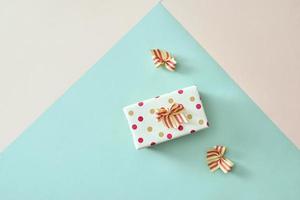 Gift box with ribbon and bow on color background photo