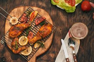 Grilled bbq chicken with fresh herbs and tomatoes photo