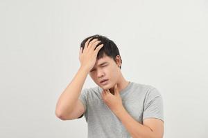 sick man has a sore throat isolated on a white background photo