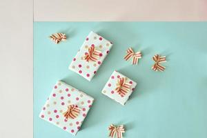 Different colored gift box on color background. photo