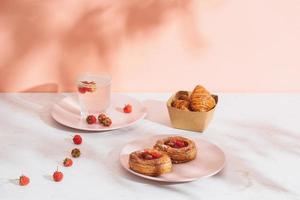 Freshly baked traditional pastry sweet mini danish raspberry and raspberries soda drinks photo
