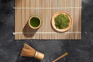 Organic Green Matcha Tea on wooden table, copyspace photo