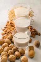 Glasses of milk Macadamia, almond, soy. Top view. photo