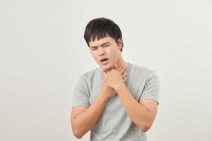 Young Asian man having throat related diseases photo