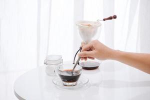Young man enjoying coffee and breakfast at a cafe photo