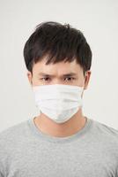 Stop the infection healthy man showing gesture stop of man wear protective mask against photo