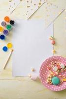 Party management and organization concept with sweets, confetti and blank pages. Creative celebration flat lay with copy space. photo