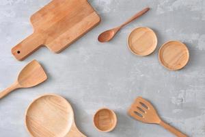 Set of wooden kitchenware on table photo