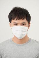 Stop the infection healthy man showing gesture stop of man wear protective mask against photo