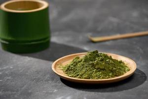 Organic Green Matcha Tea on wooden table, copyspace photo