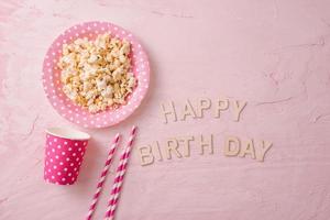 Birthday party background with party hats and birthday gifts photo