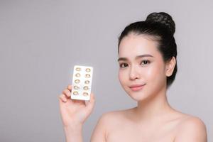 Girl is holding medicaments in hands photo