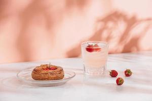 Freshly baked traditional pastry sweet mini danish raspberry and raspberries soda drinks photo