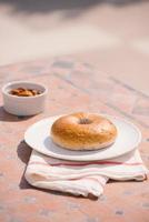 cup of coffee with bread on table in the morning with sunlight, breakfast photo