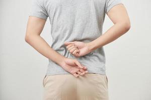 Man with back pain isolated on white background photo